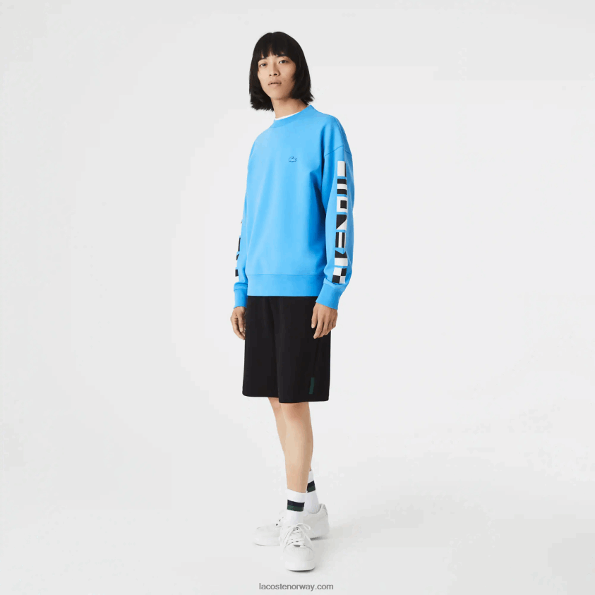 Lacoste genser med reflekterende trykk i løs passform 4J4X0T984 blå 4xa menn