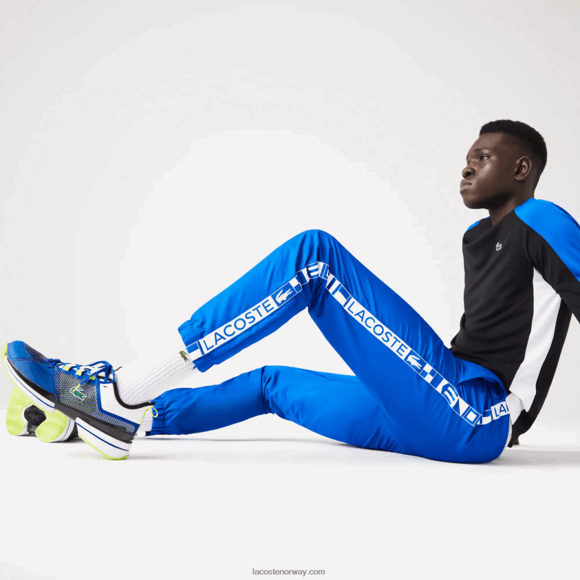 Lacoste tennis treningsbukser med trykk på siden 4J4X0T1087 blå k1q menn