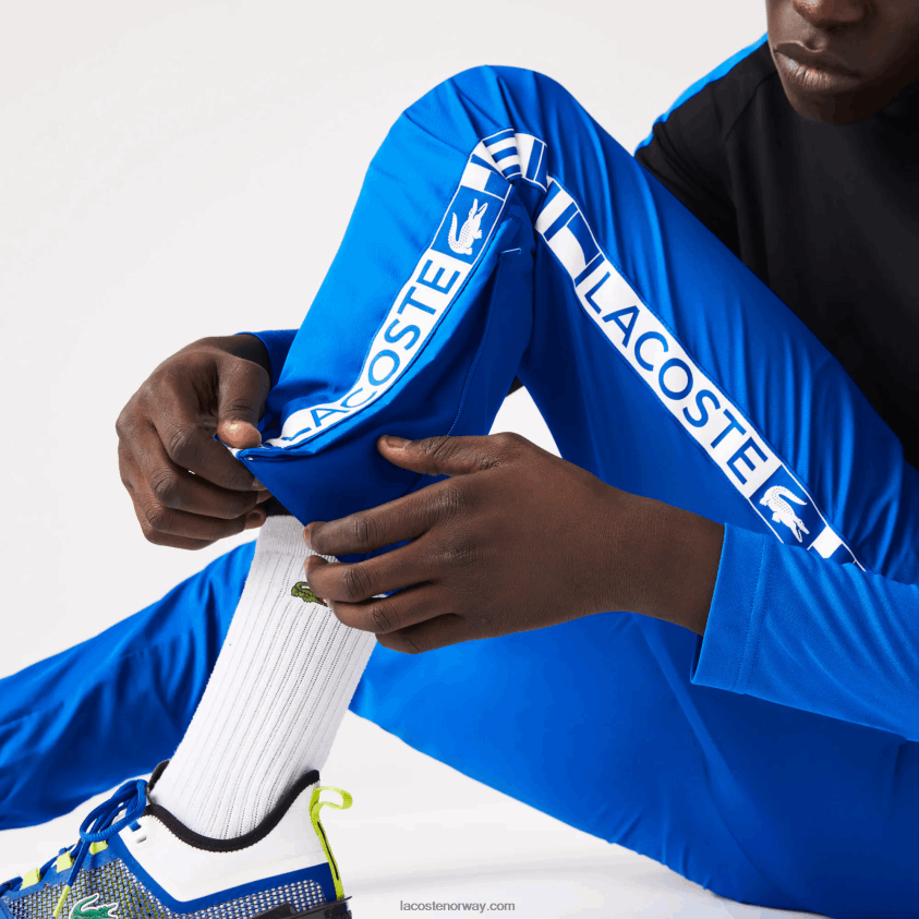 Lacoste tennis treningsbukser med trykk på siden 4J4X0T1087 blå k1q menn